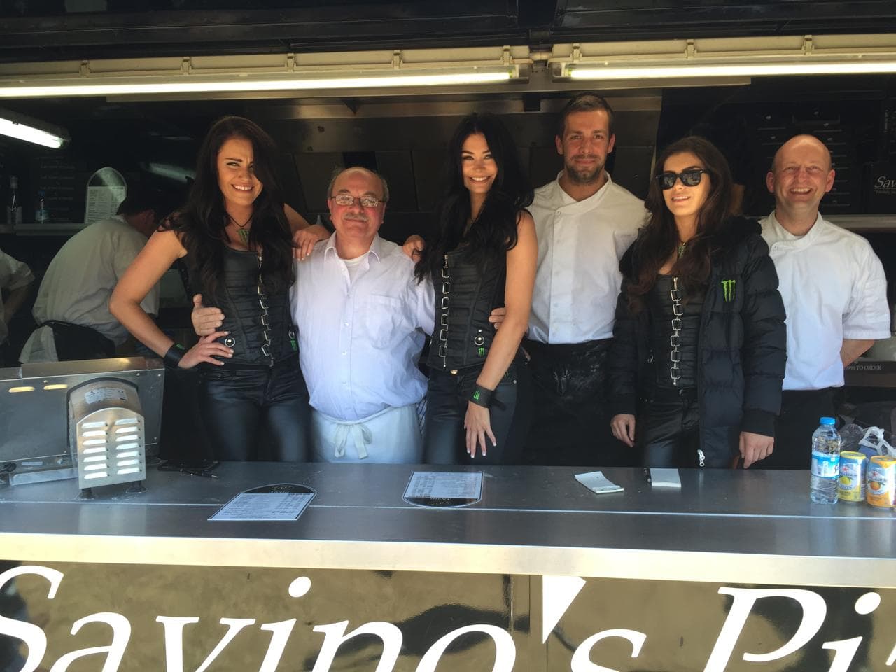 The Savino's team serving pizza